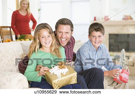 Stock Photo - Portrait Of Family At Christmas. Fotosearch