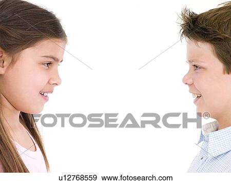 Brother and sister looking at each other smiling View Large Photo Image Stock Photo - Brother and sister looking at each other smiling. Fotosearch