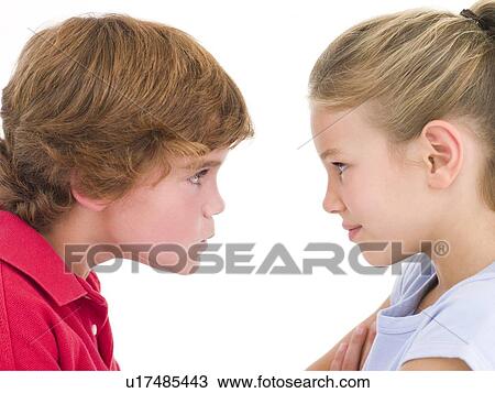 Brother and sister staring at each other View Large Photo Image Stock Image - Brother and sister staring at each other. Fotosearch