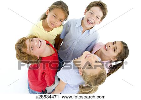 Stock Image - Circle of five young friends smiling. Fotosearch