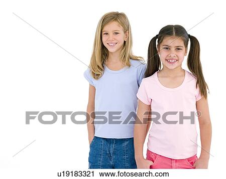 Stock Image - Two girl friends smiling. Fotosearch
