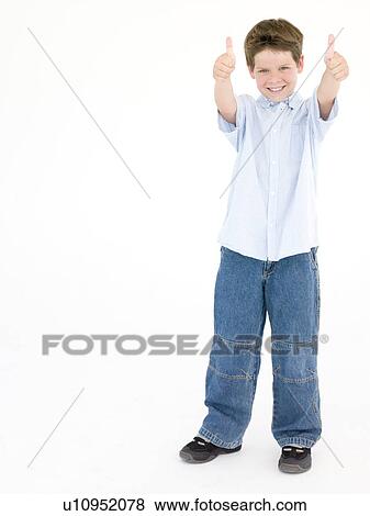 Young boy giving thumbs up smiling View Large Photo Image Stock Photo - Young boy giving thumbs up smiling. Fotosearch