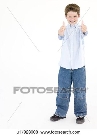 Young boy giving thumbs up smiling View Large Photo Image Stock Photo - Young boy giving thumbs up smiling. Fotosearch