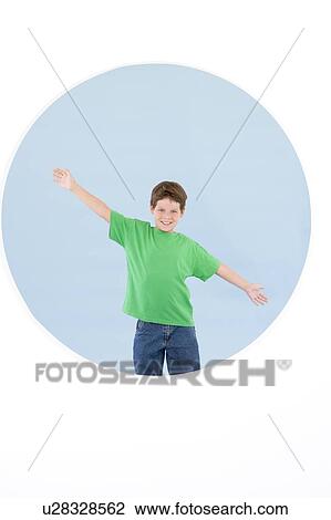 Young boy standing with arms out smiling View Large Photo Image Stock Image - Young boy standing with arms out smiling. Fotosearch