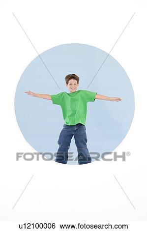 Young boy standing with arms out smiling View Large Photo Image Stock Photograph - Young boy standing with arms out smiling. Fotosearch