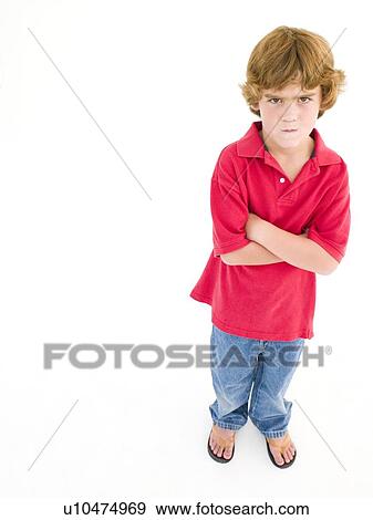 Young boy with arms crossed scowling View Large Photo Image Stock Photo - Young boy with arms crossed scowling. Fotosearch