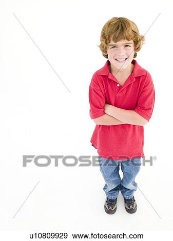 Young boy with arms crossed smiling View Large Photo Image Stock Photo - Young boy with arms crossed smiling. Fotosearch