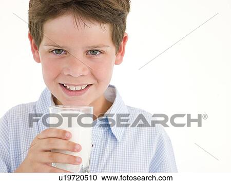 Young boy with glass of milk smiling View Large Photo Image Stock Image - Young boy with glass of milk smiling. Fotosearch