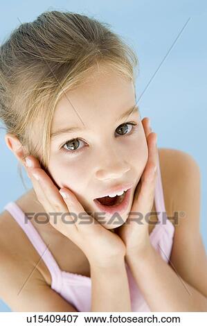 Young girl excited and surprised View Large Photo Image Stock Photo - Young girl excited and surprised. Fotosearch