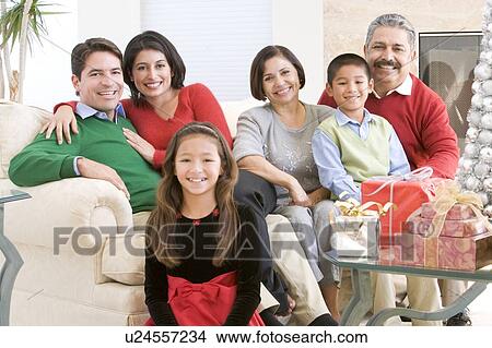 Family Sitting Around A Coffee Table And Christmas Gifts View Large Photo Image Picture - Family Sitting Around A Coffee Table And Christmas Gifts. Fotosearch