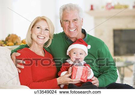 Grandparents With Baby In Santa Outfit View Large Photo Image Picture - Grandparents With Baby In Santa Outfit. Fotosearch