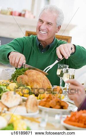 Man Carving Up Turkey At Christmas Dinner View Large Photo Image Stock Image - Man Carving Up Turkey At Christmas Dinner. Fotosearch