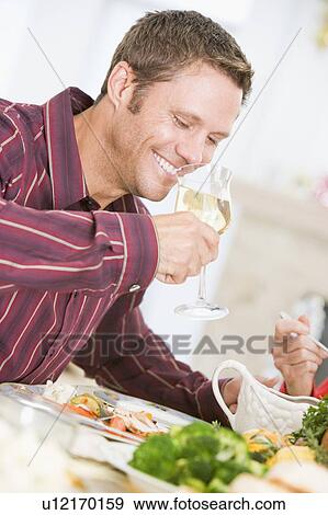Man Drinking Wine At Christmas Dinner View Large Photo Image Stock Photo - Man Drinking Wine At Christmas Dinner. Fotosearch