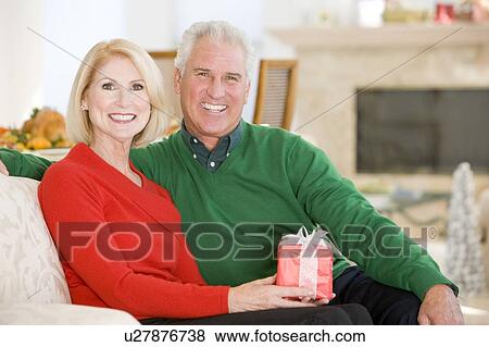 Mature Couple At Christmas View Large Photo Image Stock Photo - Mature Couple At Christmas. Fotosearch