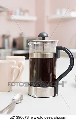 Stock Image - Coffee pot on kitchen counter. Fotosearch