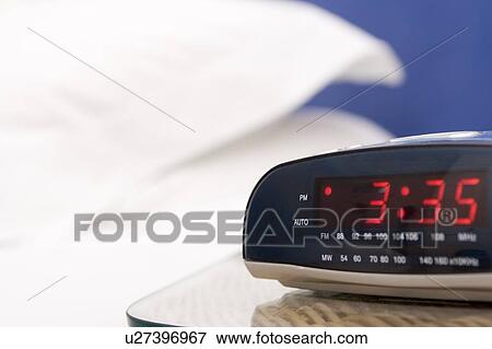 Empty bedroom with focus on alarm clock View Large Photo Image Stock Photo - Empty bedroom with focus on alarm clock. Fotosearch