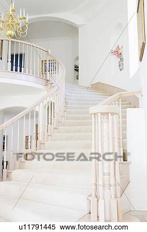 Stock Photography - Empty staircase in luxurious home. Fotosearch