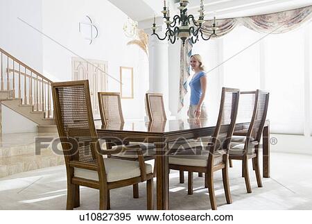 Woman in dining room smiling View Large Photo Image Stock Photography - Woman in dining room smiling. Fotosearch