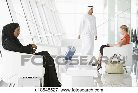 Airline passengers waiting in departure gate View Large Photo Image Stock Photo - Airline passengers waiting in departure gate. Fotosearch