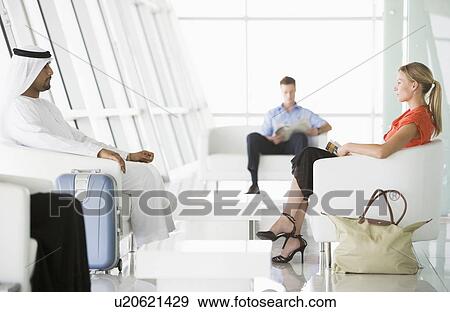 Airline passengers waiting in departure gate View Large Photo Image Stock Photo - Airline passengers waiting in departure gate. Fotosearch
