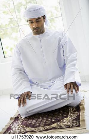 Man in turban praying on mat (high key) View Large Photo Image Stock Image - Man in turban praying on mat (high key). Fotosearch