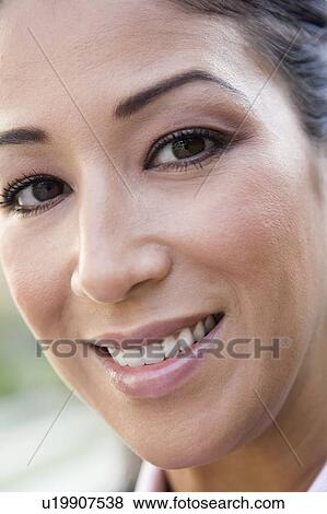 Woman's smiling face outdoors (selective focus) View Large Photo Image Stock Photo - Woman's smiling face outdoors (selective focus). Fotosearch