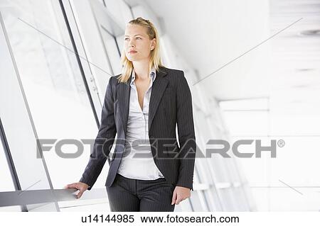 Businesswoman standing in corridor View Large Photo Image Stock Photography - Businesswoman standing in corridor. Fotosearch