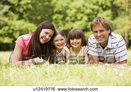 Family outdoors smiling View Large Photo Image Stock Photograph - Family outdoors smiling. Fotosearch