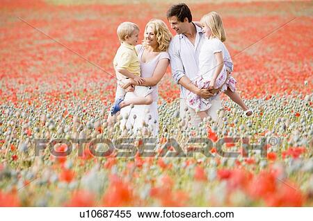 Family standing in poppy field smiling View Large Photo Image Stock Photography - Family standing in poppy field smiling. Fotosearch