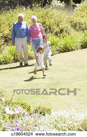 Grandparents walking with grandchildren. View Large Photo Image Picture - Grandparents walking with grandchildren.. Fotosearch
