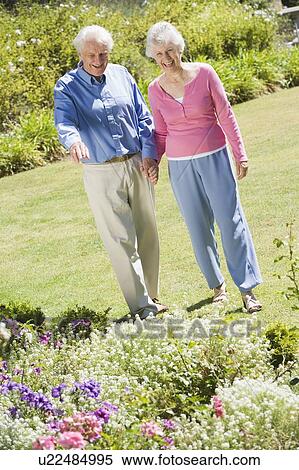 Senior couple in a flower garden View Large Photo Image Stock Photography - Senior couple in a flower garden. Fotosearch