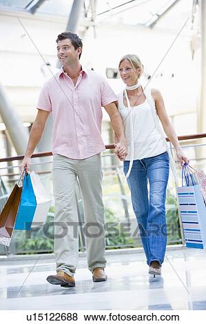 Stock Photo - Young couple at a shopping mall. Fotosearch
