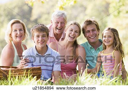 Picture - Family at a picnic smiling. Fotosearch
