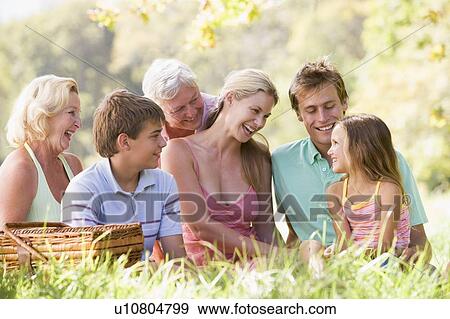 Family at a picnic smiling View Large Photo Image Stock Photo - Family at a picnic smiling. Fotosearch