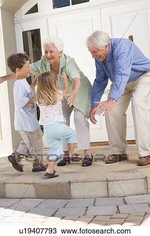 Grandparents welcoming grandchildren. View Large Photo Image Stock Image - Grandparents welcoming grandchildren.. Fotosearch