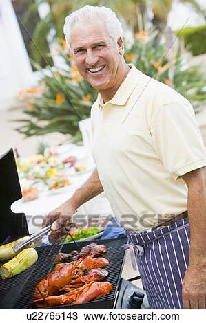 Man Barbequing In A Garden View Large Photo Image Stock Image - Man Barbequing In A Garden. Fotosearch