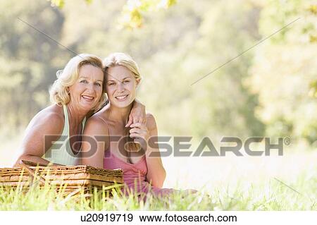 Mother with adult daughter on picnic View Large Photo Image Stock Photo - Mother with adult daughter on picnic. Fotosearch