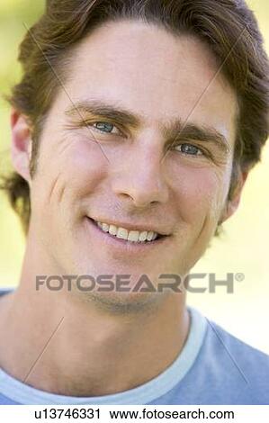 Stock Image - Head shot of man smiling. Fotosearch
