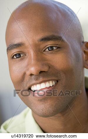 Stock Image - Head shot of man smiling. Fotosearch