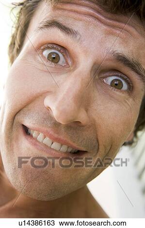 Stock Image - Head shot of man smiling. Fotosearch