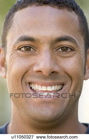 Stock Photo - Head shot of man smiling. Fotosearch