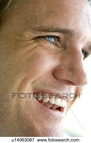 Stock Photo - Head shot of man smiling. Fotosearch