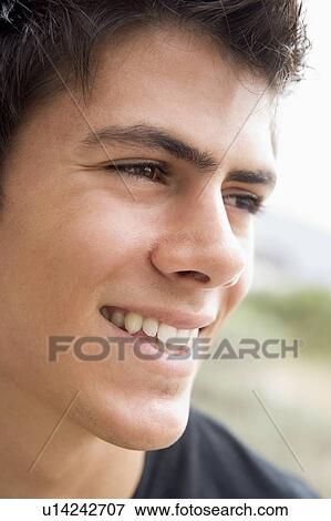 Stock Photo - Head shot of man smiling. Fotosearch