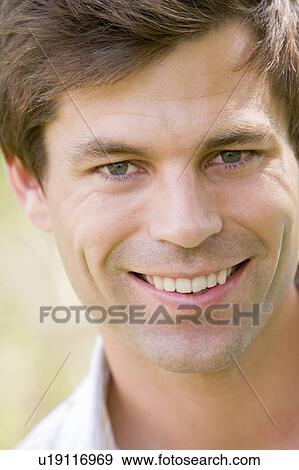 Stock Photo - Head shot of man smiling. Fotosearch
