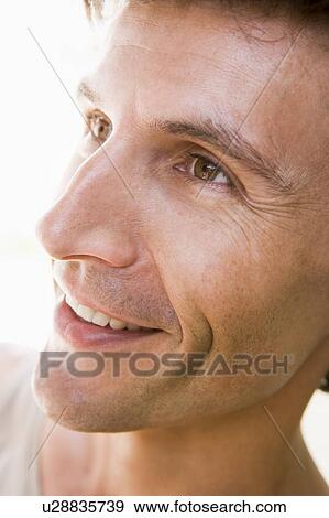 Stock Photo - Head shot of man smiling. Fotosearch