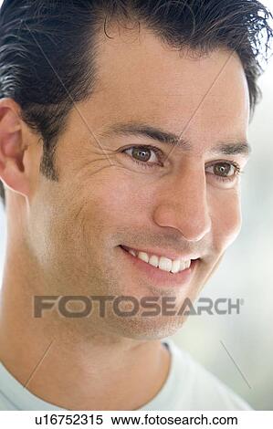 Stock Photography - Head shot of man smiling. Fotosearch