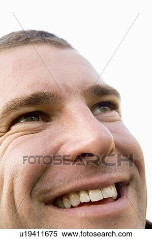 Stock Photography - Head shot of man smiling. Fotosearch
