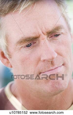 Head shot of man thinking View Large Photo Image Stock Image - Head shot of man thinking. Fotosearch