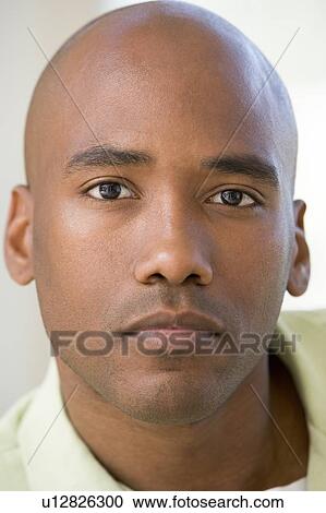 Stock Image - Head shot of man thinking. Fotosearch