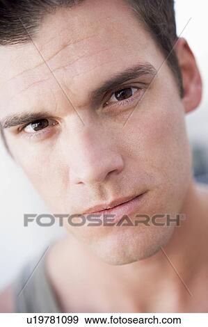 Head shot of man thinking View Large Photo Image Stock Photo - Head shot of man thinking. Fotosearch